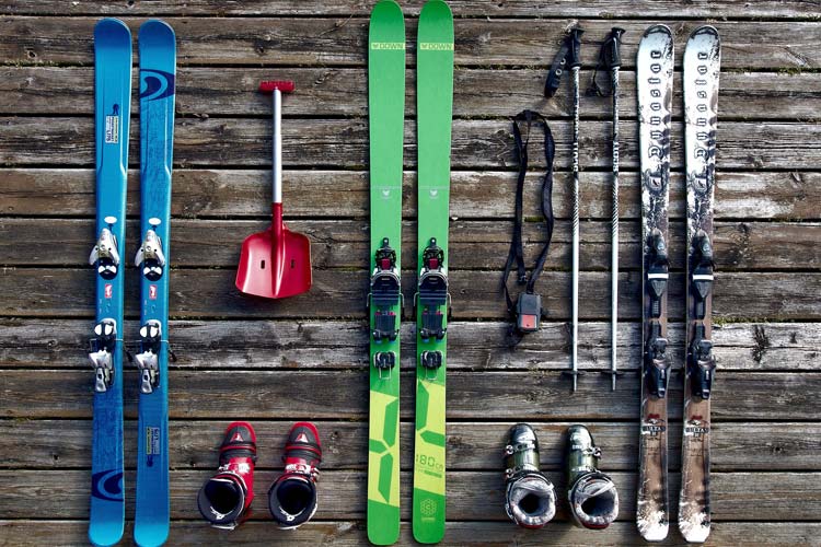 Skis on a wooden background