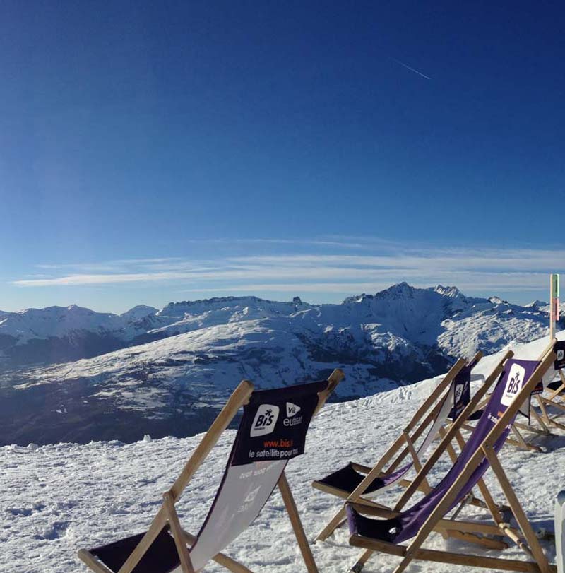 Deck chair on the snow in the mountains